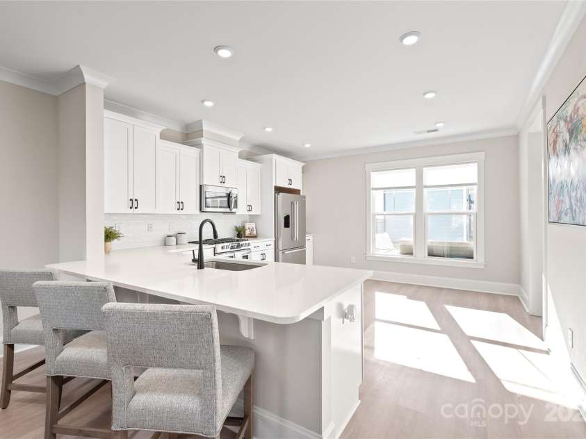 1066 Riverwalk Parkway, Rock Hill, SC 29730.  MLS# CAR4210322, YatesRealty ID 1366. The kitchen is a chef’s dream! Bright and modern with quartz countertops, stainless steel appliances, and plenty of space to create and gather.