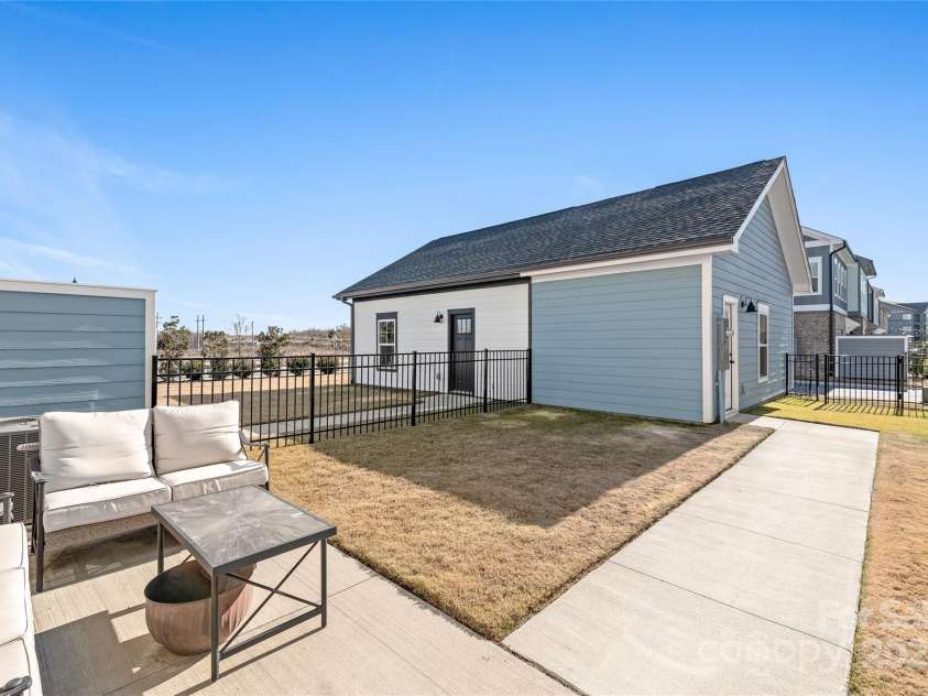 1066 Riverwalk Parkway, Rock Hill, SC 29730.  MLS# CAR4210322, YatesRealty ID 1366. The spacious, fully fenced backyard offers privacy and plenty of room to enjoy, with easy access to the garage for all your storage needs!