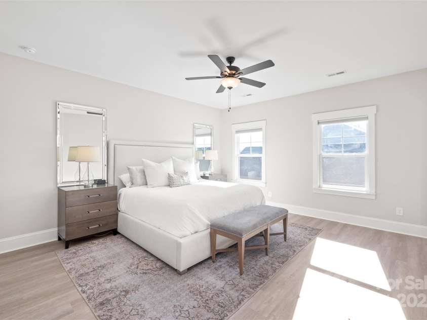 1066 Riverwalk Parkway, Rock Hill, SC 29730.  MLS# CAR4210322, YatesRealty ID 1366. The spacious primary bedroom connects to its own en-suite, featuring dual sinks and semi-frameless walk-in shower.