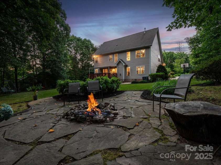 821 Lynnwood Farms Drive, Fort Mill, SC 29715.  MLS# CAR4234073, YatesRealty ID 13664. Back/Firepit Twilight