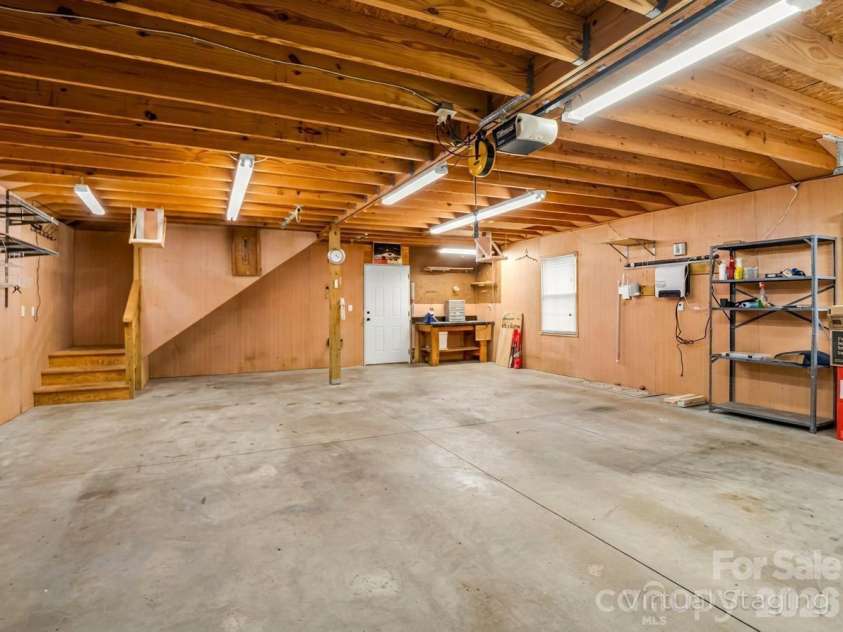 190 Observation Ridge, Rutherfordton, NC 28139.  MLS# CAR4351178, YatesRealty ID 13668. Garage-back door exit to shed