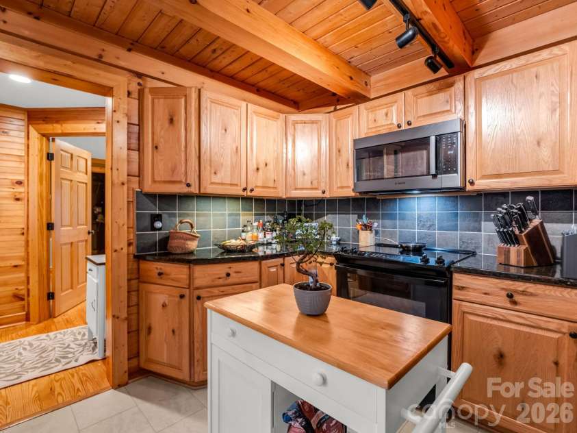 190 Observation Ridge, Rutherfordton, NC 28139.  MLS# CAR4351178, YatesRealty ID 13668. Kitchen off Primary Bedroom and outside entry