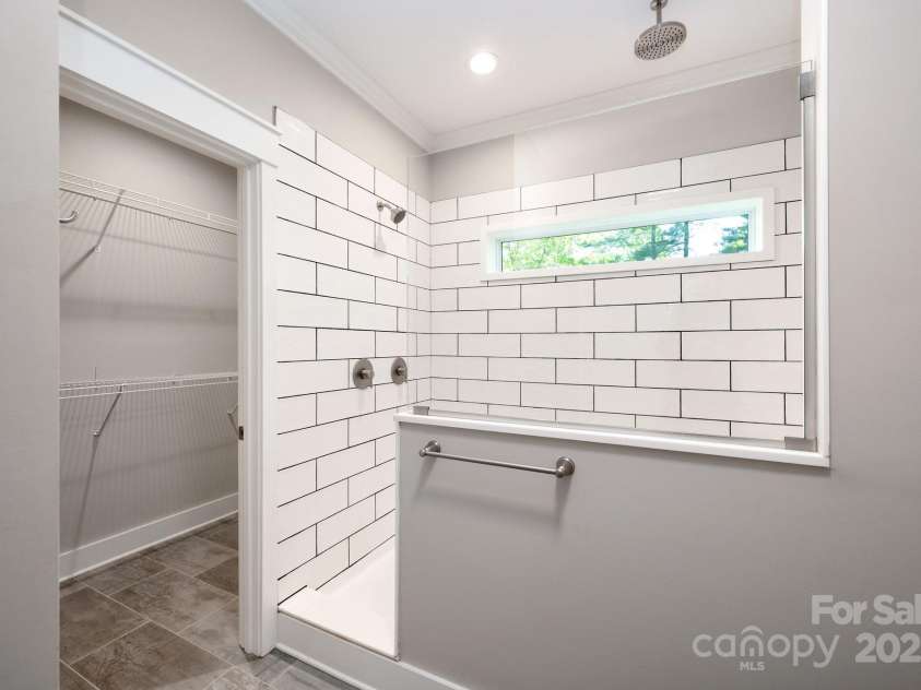 115 Summer Pine Lane, Fairview, NC 28730.  MLS# CAR4252070, YatesRealty ID 13675. Luxurious primary shower and walk in closet