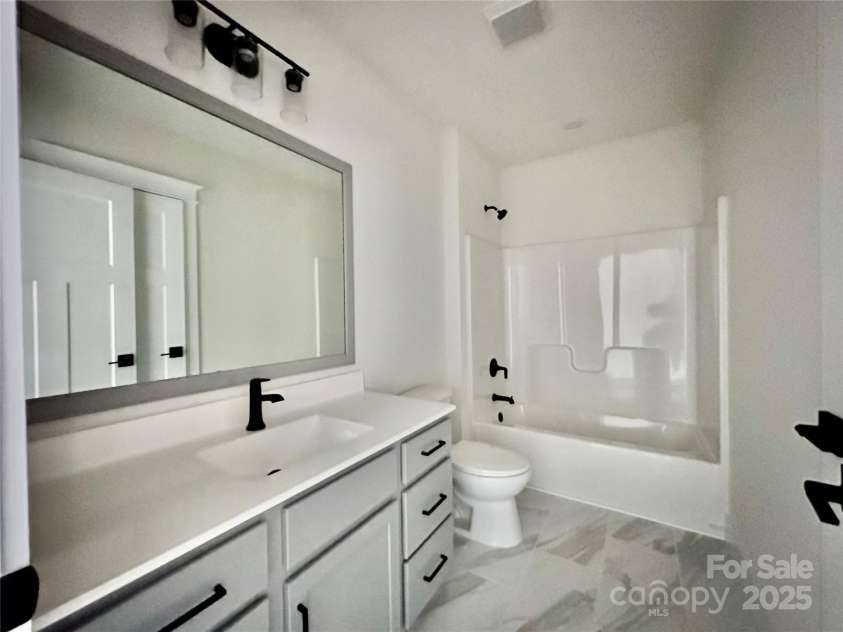 1023 Padgett Place, Black Mountain, NC 28711.  MLS# CAR4186121, YatesRealty ID 13685. Guest Bathroom