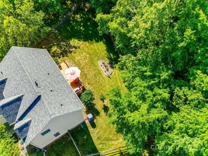 9700 Stewart Spring Lane, Charlotte, NC 28216.  MLS# CAR4252858, YatesRealty ID 13687. Aerial view of home/yard
