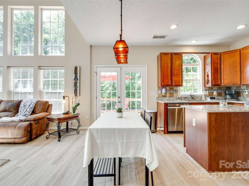 9700 Stewart Spring Lane, Charlotte, NC 28216.  MLS# CAR4252858, YatesRealty ID 13687. Breakfast area with doors to back deck and private yard
