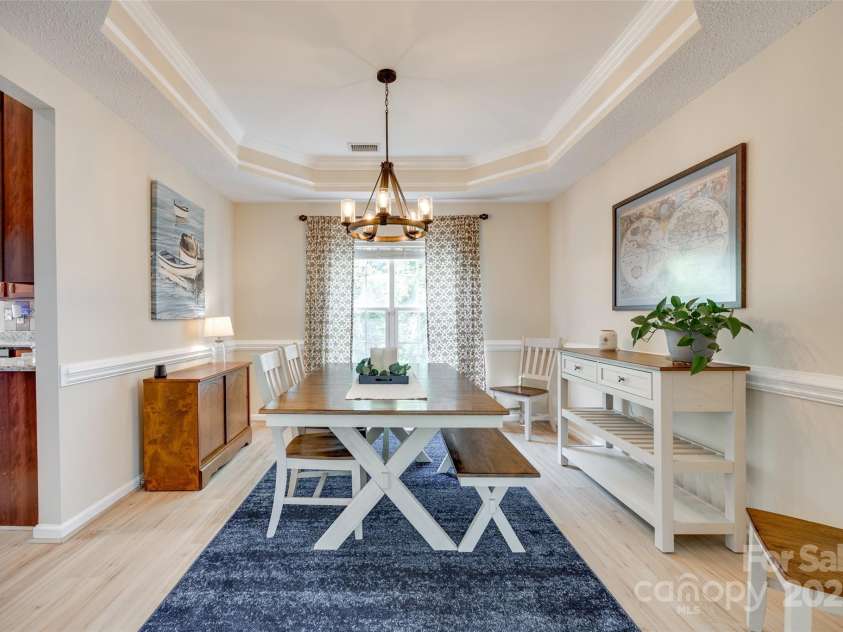 9700 Stewart Spring Lane, Charlotte, NC 28216.  MLS# CAR4252858, YatesRealty ID 13687. Formal dining room with tray ceiling and new flooring