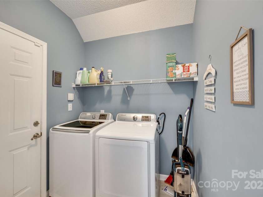 9700 Stewart Spring Lane, Charlotte, NC 28216.  MLS# CAR4252858, YatesRealty ID 13687. Laundry room and garage entry