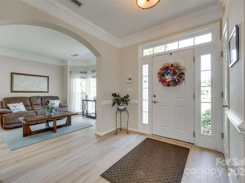 9700 Stewart Spring Lane, Charlotte, NC 28216.  MLS# CAR4252858, YatesRealty ID 13687. Main entry with and formal living room with bay windows