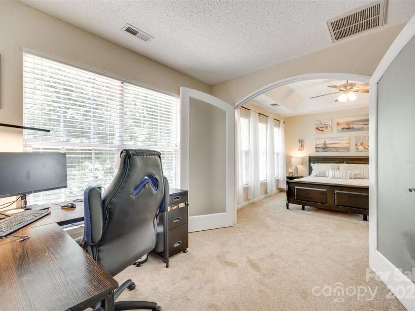 9700 Stewart Spring Lane, Charlotte, NC 28216.  MLS# CAR4252858, YatesRealty ID 13687. Office and primary bedroom