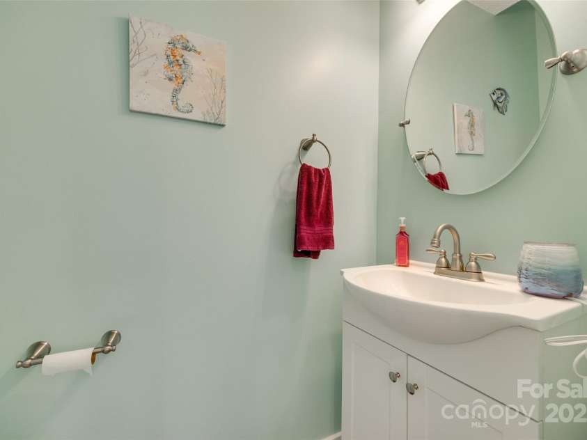 9700 Stewart Spring Lane, Charlotte, NC 28216.  MLS# CAR4252858, YatesRealty ID 13687. Powder room on the main level