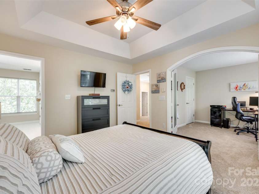9700 Stewart Spring Lane, Charlotte, NC 28216.  MLS# CAR4252858, YatesRealty ID 13687. Primary bedroom and office with French doors