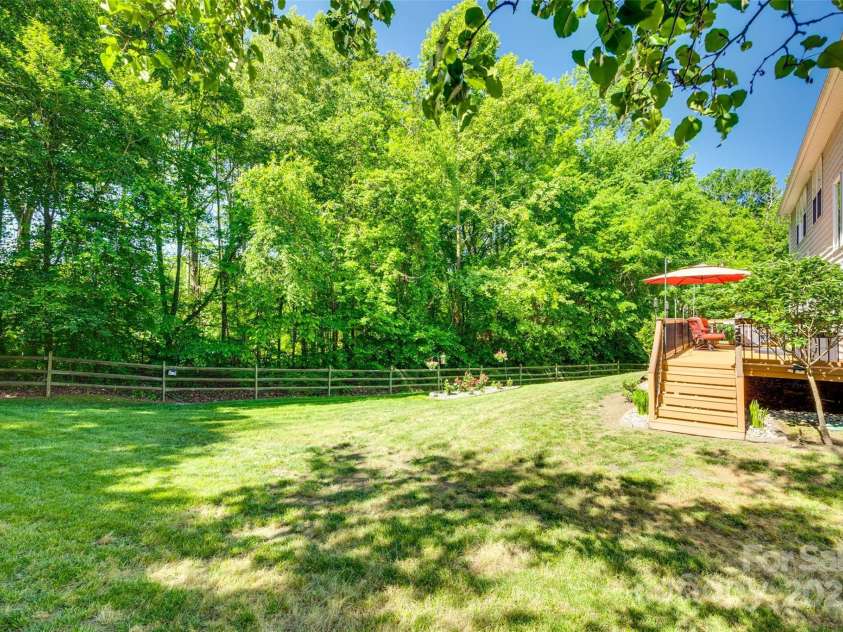 9700 Stewart Spring Lane, Charlotte, NC 28216.  MLS# CAR4252858, YatesRealty ID 13687. Private, fenced backyard
