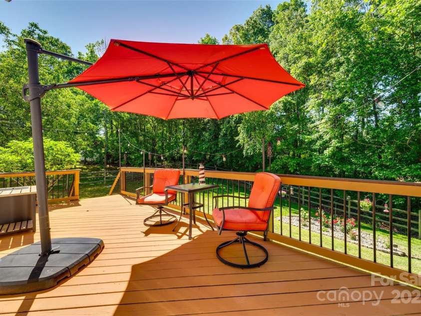 9700 Stewart Spring Lane, Charlotte, NC 28216.  MLS# CAR4252858, YatesRealty ID 13687. Private rear deck overlooking fenced backyard