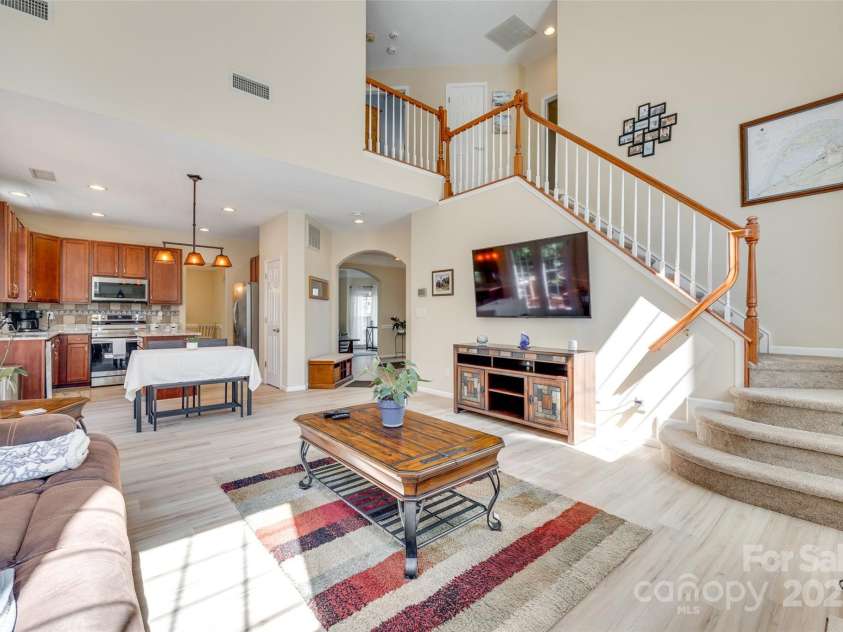 9700 Stewart Spring Lane, Charlotte, NC 28216.  MLS# CAR4252858, YatesRealty ID 13687. Two-story great room open to kitchen and breakfast nook