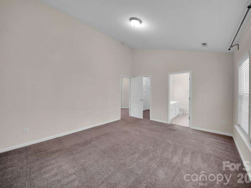 3917 Caliper Place, Fort Mill, SC 29708.  MLS# CAR4370765, YatesRealty ID 13699. Primary Bedroom with Cathedral Ceiling