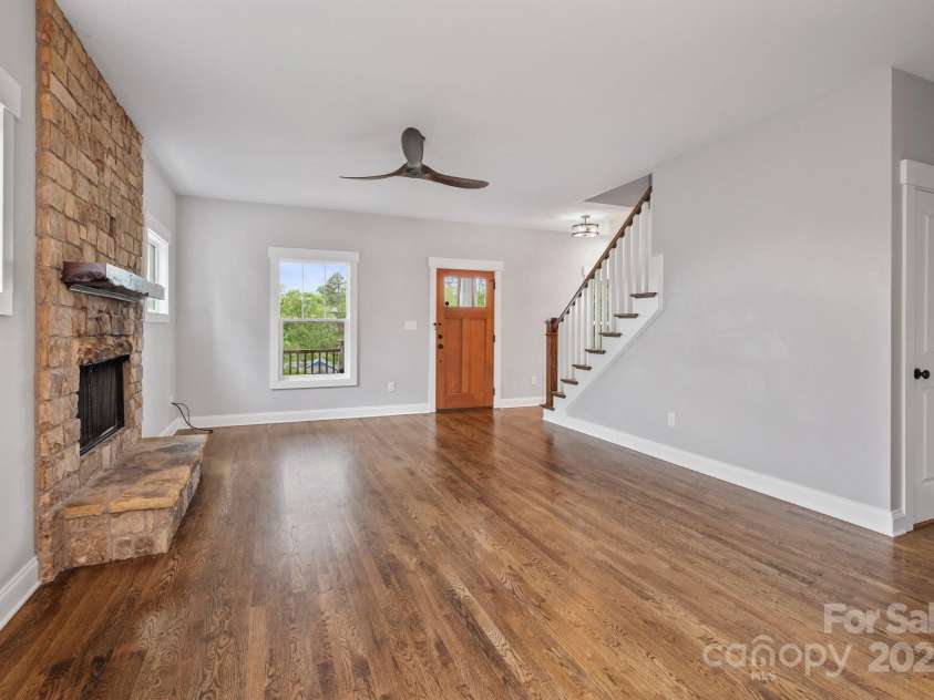 95 Beaver Drive, Asheville, NC 28804.  MLS# CAR4258303, YatesRealty ID 13700. Stone Fireplace in Living Room