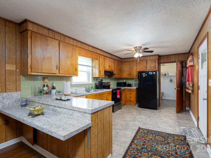 40359 Barnhardt Road, New London, NC 28127.  MLS# CAR4235032, YatesRealty ID 13706. Laundry room /half bath combo