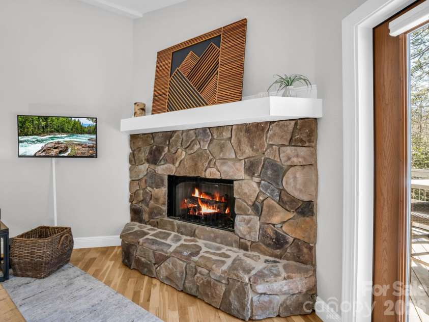 121 Fern Loop, Lake Lure, NC 28746.  MLS# CAR4357970, YatesRealty ID 13717. Stone Fireplace upper level
