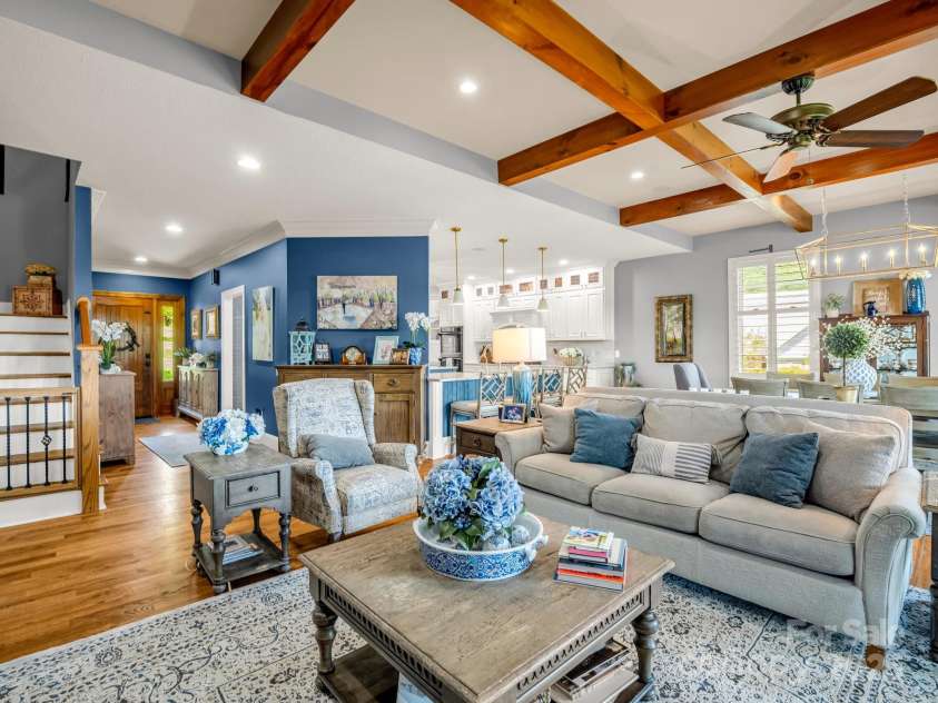 1903 Country Club Road, Hendersonville, NC 28739.  MLS# CAR4258556, YatesRealty ID 13720. Another view of the great room with steps to upper and lower levels to the left