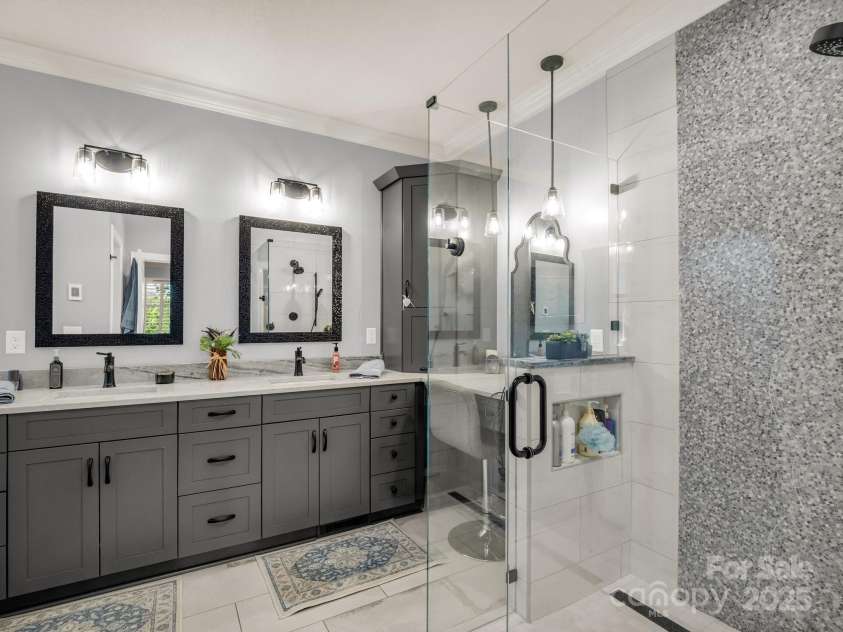 1903 Country Club Road, Hendersonville, NC 28739.  MLS# CAR4258556, YatesRealty ID 13720. Ensuite primary bath with walk-in shower and dual sinks