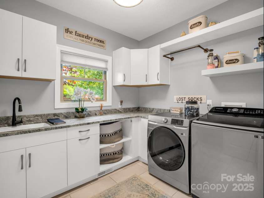 1903 Country Club Road, Hendersonville, NC 28739.  MLS# CAR4258556, YatesRealty ID 13720. Laundry room just off of the garage