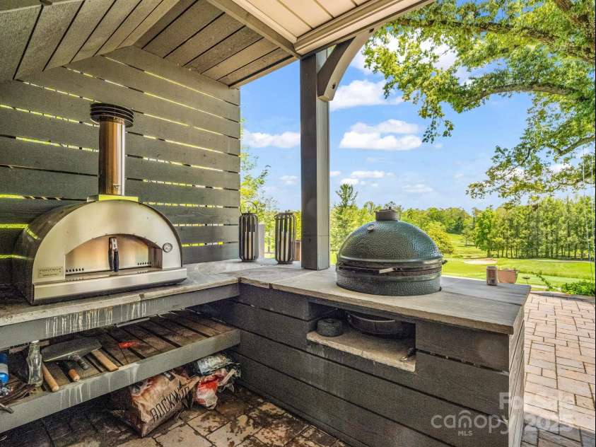 1903 Country Club Road, Hendersonville, NC 28739.  MLS# CAR4258556, YatesRealty ID 13720. Outdoor kitchen on lower porch
