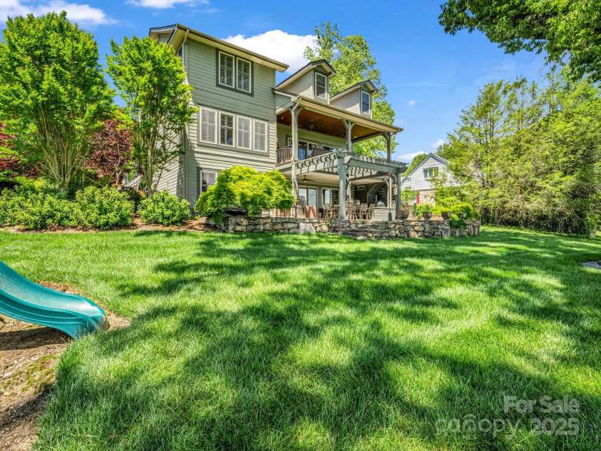 1903 Country Club Road, Hendersonville, NC 28739.  MLS# CAR4258556, YatesRealty ID 13720. Upper and lower porches to enjoy the view of the fairway