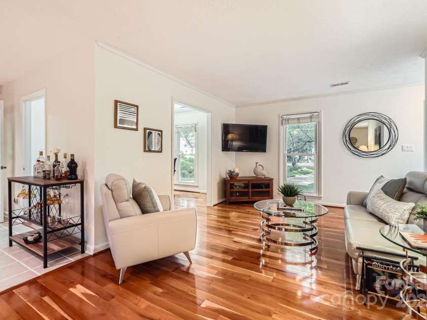 4145 Wall Street, Charlotte, NC 28209.  MLS# CAR4215362, YatesRealty ID 13725. Living room with beautiful wood floors that carry through out most of the home.