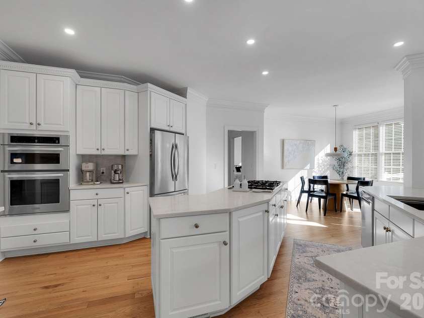 7778 Burning Ridge Drive, Stanley, NC 28164.  MLS# CAR4336313, YatesRealty ID 13726. Additional kitchen view highlighting stainless steel appliances, ample counter space, and abundant cabinetry. The layout supports both everyday use and entertaining.