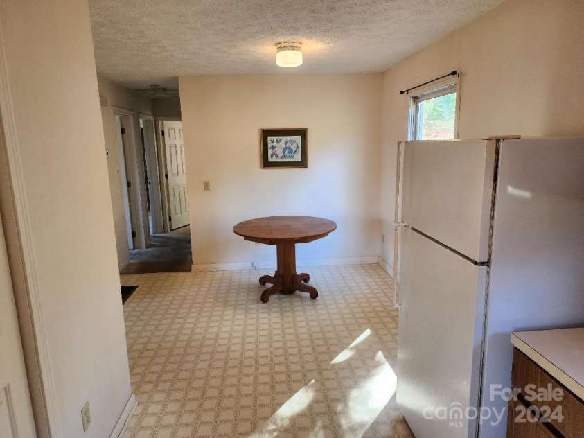 20 Coventry Lane, Burnsville, NC 28714.  MLS# CAR4199768, YatesRealty ID 13750. Dining Area viewed from the kitchen