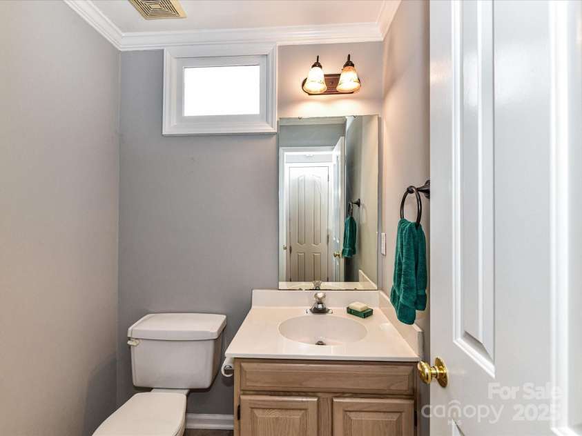4743 Morning Dew Court, Charlotte, NC 28269.  MLS# CAR4244275, YatesRealty ID 13756. Main level Guest Bathroom !