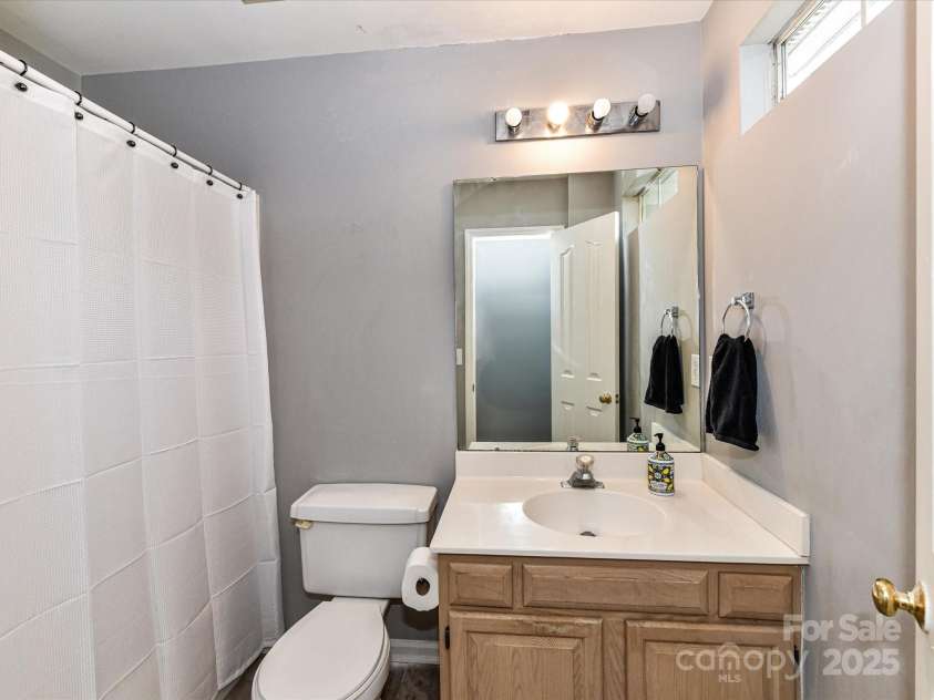 4743 Morning Dew Court, Charlotte, NC 28269.  MLS# CAR4244275, YatesRealty ID 13756. Private bathroom attached to the 2nd bedroom with shower and cabinets for storage