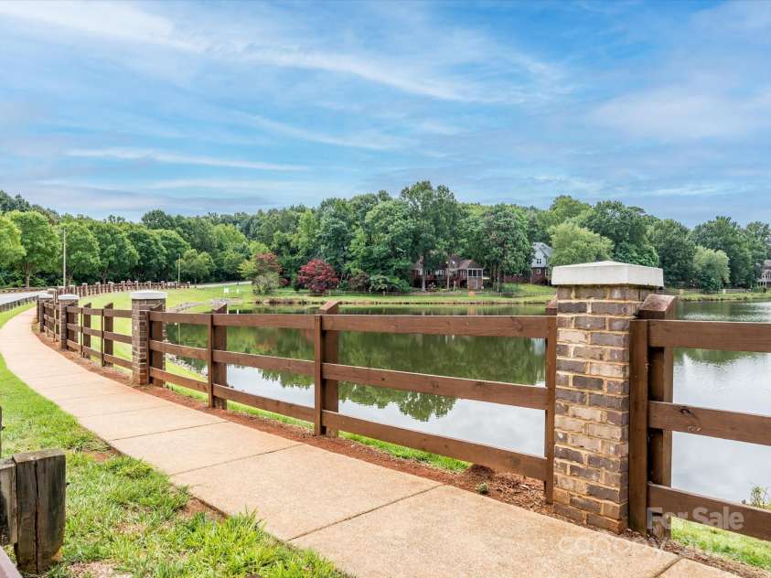 4743 Morning Dew Court, Charlotte, NC 28269.  MLS# CAR4244275, YatesRealty ID 13756. Walkway around Davis Lake!