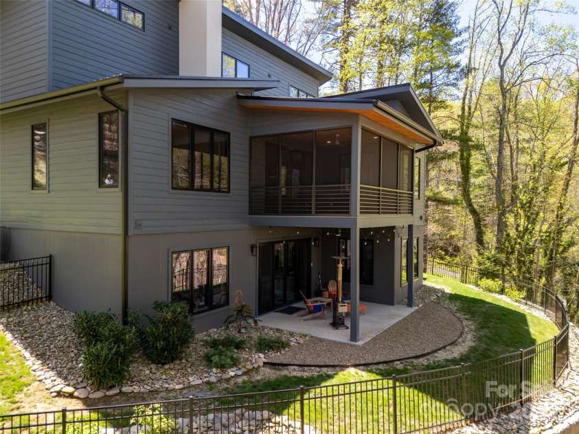 42 Spring Cove Road, Asheville, NC 28804.  MLS# CAR4246585, YatesRealty ID 13759. Dual-tiered exterior living/entertaining spaces and newly fenced rear yard.