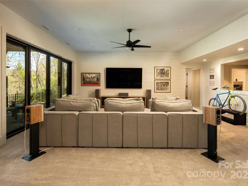 42 Spring Cove Road, Asheville, NC 28804.  MLS# CAR4246585, YatesRealty ID 13759. Family room also opens to outdoor covered porch.