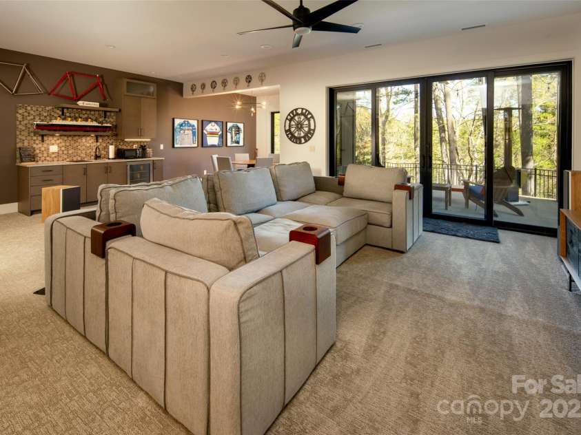 42 Spring Cove Road, Asheville, NC 28804.  MLS# CAR4246585, YatesRealty ID 13759. The lower level is a DREAM entertaining space!!  This monstrously large living area offers room for home theater, dining, and refreshments! Pictures don't adequately capture the size of this space.