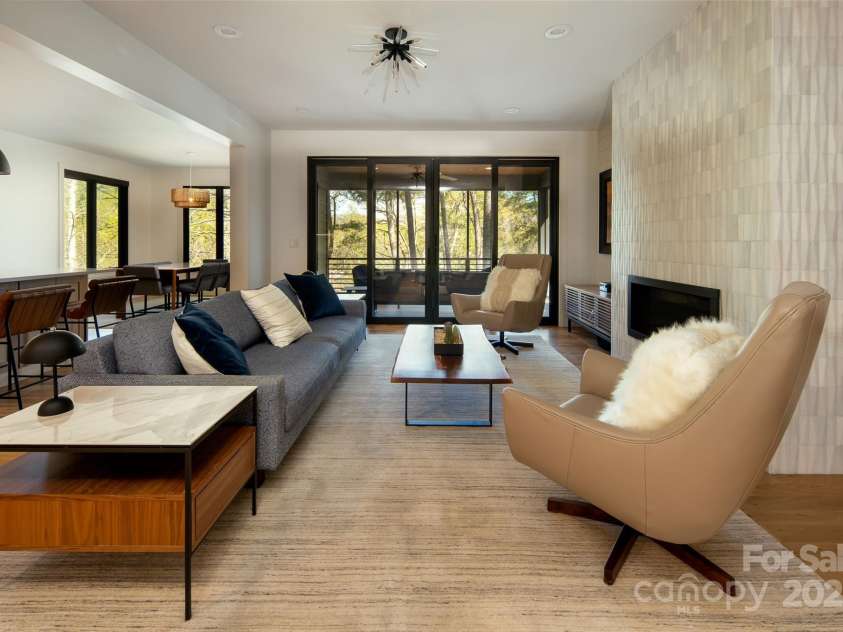 42 Spring Cove Road, Asheville, NC 28804.  MLS# CAR4246585, YatesRealty ID 13759. Uninterrupted sight-lines through the main living space out to the covered/screened porch and lush views.