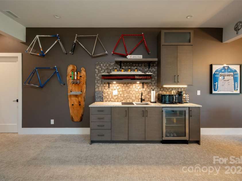 42 Spring Cove Road, Asheville, NC 28804.  MLS# CAR4246585, YatesRealty ID 13759. You'll enjoy this custom wet bar area with BUILT-IN custom beer 