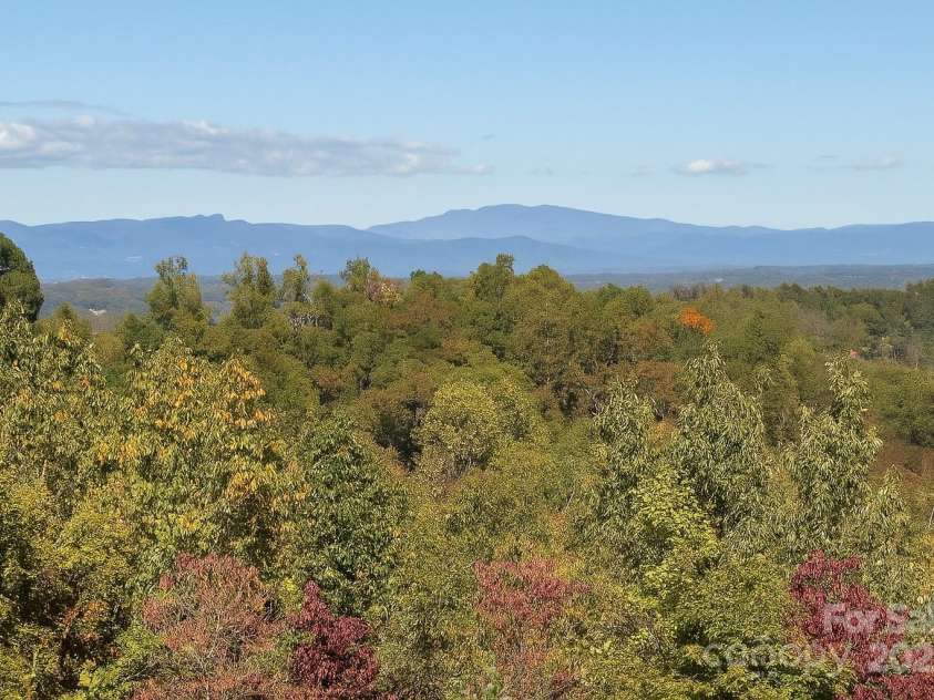 381 Scenic Overlook Drive, Nebo, NC 28761.  MLS# CAR4294911, YatesRealty ID 1376. Grandfather Mountain & Table Rock View from Screened Porch