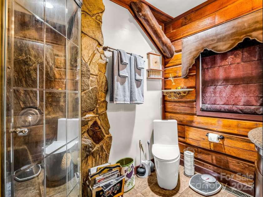1002 CC Road, Rutherfordton, NC 28139.  MLS# CAR4249234, YatesRealty ID 13761. Custom stonework in walk-in shower.