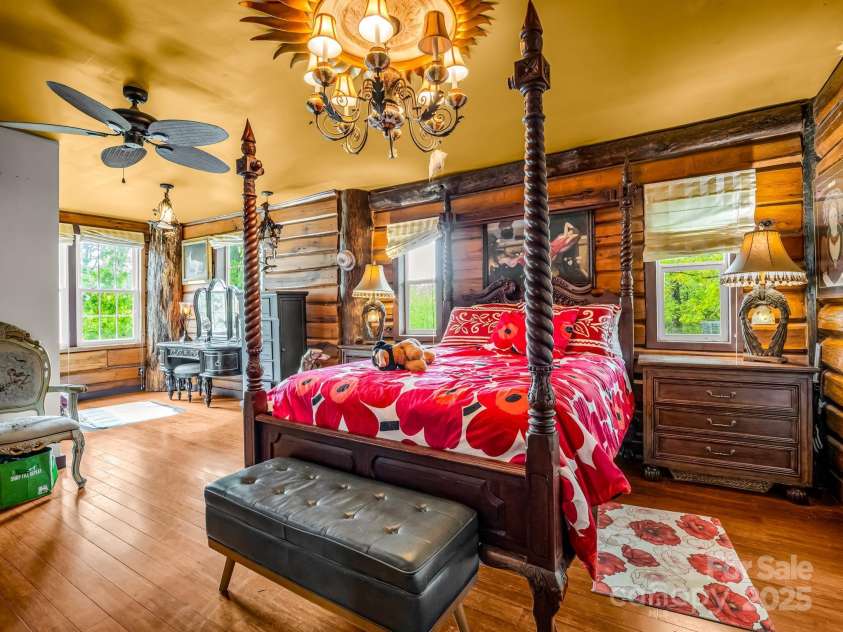 1002 CC Road, Rutherfordton, NC 28139.  MLS# CAR4249234, YatesRealty ID 13761. En suite primary bedroom offers a dressing area, full bathroom, enormous walk-in closet, and separate laundry room accessible through French doors.