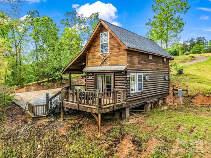 1002 CC Road, Rutherfordton, NC 28139.  MLS# CAR4249234, YatesRealty ID 13761. Guest cabin offers a cozy getaway for guests or a vacation rental. is the 1st floor is approximately 633 with A/C and space heaters, the upstairs loft/bedroom is approx 355 sq feet with A/C and a fireplace.
