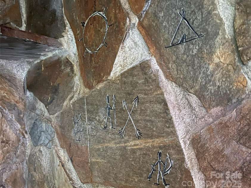 1002 CC Road, Rutherfordton, NC 28139.  MLS# CAR4249234, YatesRealty ID 13761. Hieroglyphics etched into the stones.