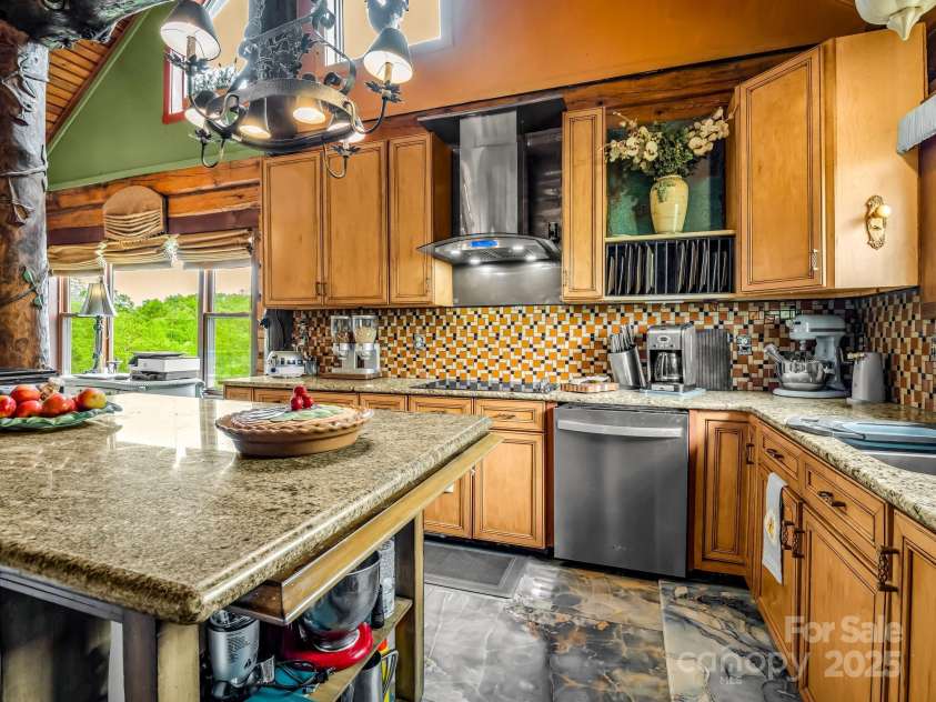 1002 CC Road, Rutherfordton, NC 28139.  MLS# CAR4249234, YatesRealty ID 13761. Island kitchen with granite countertops and new porcelain tile flooring.