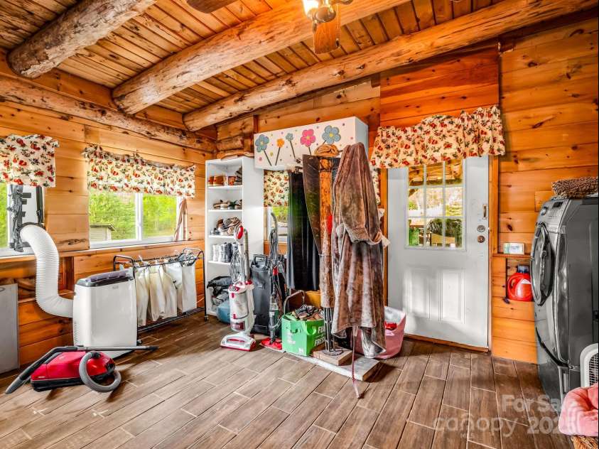 1002 CC Road, Rutherfordton, NC 28139.  MLS# CAR4249234, YatesRealty ID 13761. Large laundry room accessible from the primary bedroom and an exterior door from the side deck.