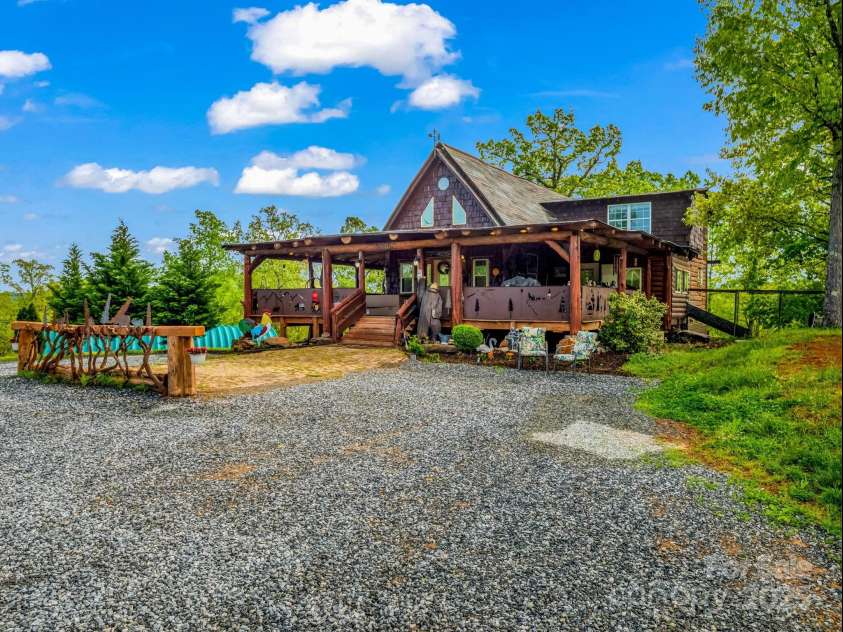 1002 CC Road, Rutherfordton, NC 28139.  MLS# CAR4249234, YatesRealty ID 13761. Recently stained log cabin located off of Polk County Line Road is convenient to town and the Tryon International Equestrian Center (TIEC).