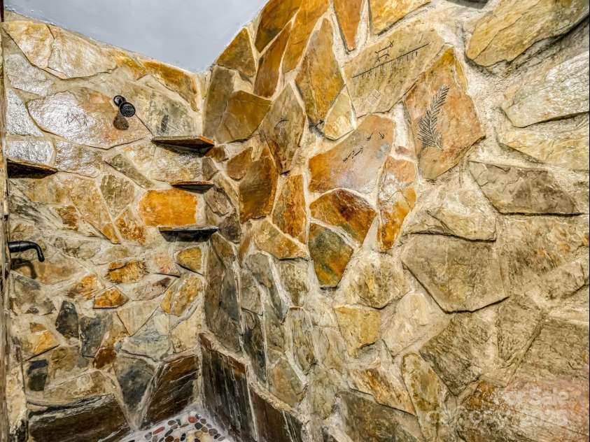 1002 CC Road, Rutherfordton, NC 28139.  MLS# CAR4249234, YatesRealty ID 13761. Stonework in upstairs shower.