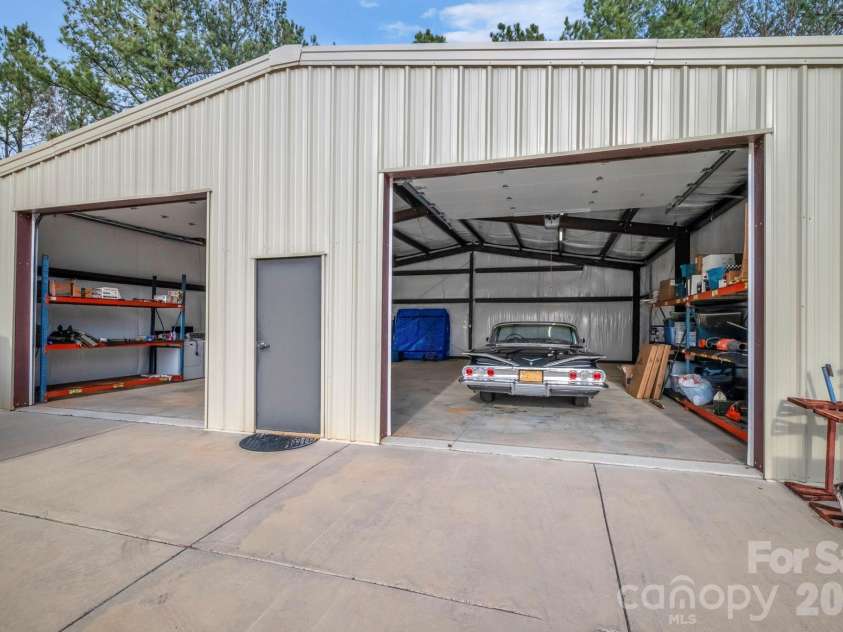 7812 Hwy 742 Highway, Marshville, NC 28103.  MLS# CAR4383299, YatesRealty ID 13761. 40'x40' steel framed shop with concrete flooring and 2 electric garage doors