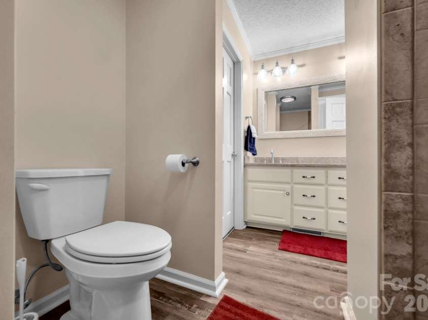 7812 Hwy 742 Highway, Marshville, NC 28103.  MLS# CAR4383299, YatesRealty ID 13761. En-suite primary bedroom bathroom